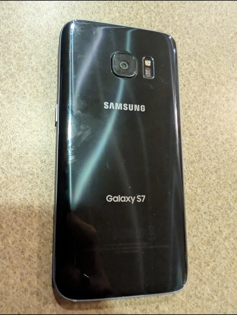 Samsung Black Smartphone with Blue Home Screen
